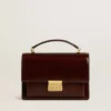 Venezia-Tasche aus dunkelbraunem laminiertem Leder mit goldenen Details
