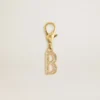 Anhänger in Form des Buchstabens B aus goldfarbenem Messing mit Kristallen