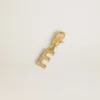Anhänger in Form des Buchstabens E aus goldfarbenem Messing mit Kristallen