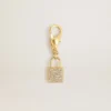 Anhänger in Schlossform aus goldfarbenem Messing mit Kristallen