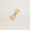 Anhänger in Schlossform aus goldfarbenem Messing mit Kristallen