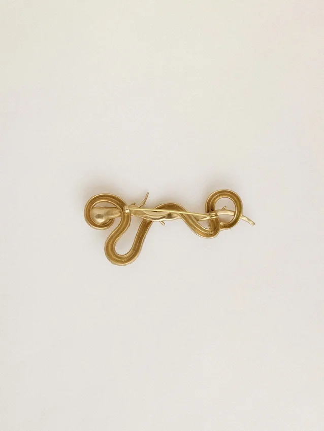 Antikgoldfarbene Brosche in Schlangenform