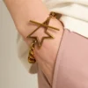 Armband aus antikgoldfarbener, sich verjüngender Kette mit sternförmigem Verschluss
