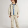 Beige Kinderjacke mit mehrfarbigen Spritzern