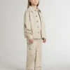 Beige Kinderjacke mit mehrfarbigen Spritzern