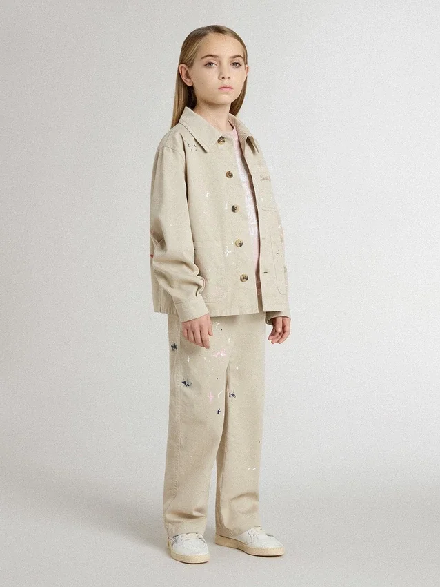 Beige Kinderjacke mit mehrfarbigen Spritzern
