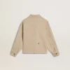 Beige Kinderjacke mit mehrfarbigen Spritzern