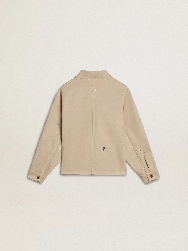 Beige Kinderjacke mit mehrfarbigen Spritzern