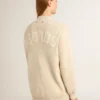 Beigefarbene Damen-Strickjacke mit «Golden»-Schriftzug auf dem Rücken