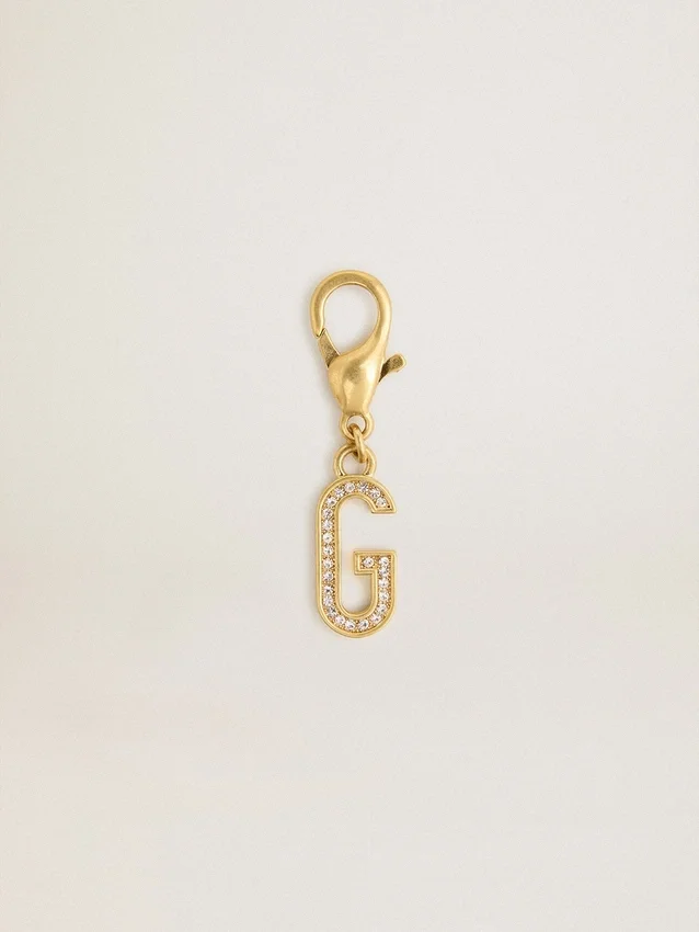 Buchstabe G als Anhänger aus goldfarbenem Messing mit Kristallen