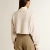 Cremefarbenes, kurzes Damen-Sweatshirt aus Baumwolle mit Kristallen auf der Vorderseite