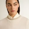 Cremefarbenes, kurzes Damen-Sweatshirt aus Baumwolle mit Kristallen auf der Vorderseite
