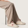 Damen-Modell «Ball Star LTD» aus beigem Leder mit rosa Mesh-Stern und blauer Fersenlasche aus Leder