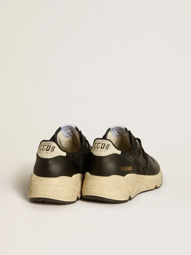 Damen-Running Sole in schwarzem Glitzer mit Lederstern und Fersenlasche aus Nubukleder