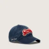 Denimblaue Baseballkappe mit rot-weissem Frottee-«Golden»-Aufnäher