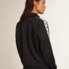 Dunkelblaues Sweatshirt mit Reissverschluss, weissem Streifen und kontrastierenden Sternen