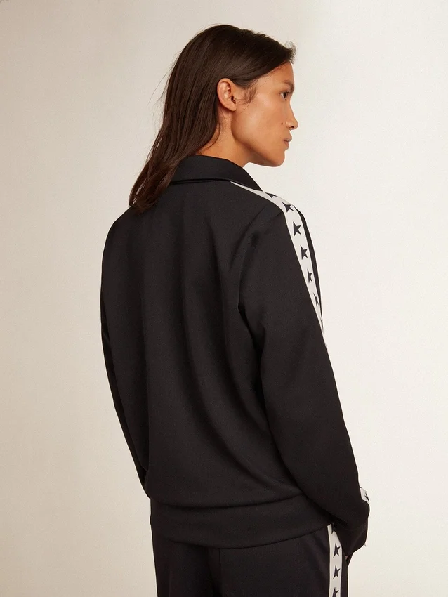 Dunkelblaues Sweatshirt mit Reissverschluss, weissem Streifen und kontrastierenden Sternen