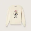 Goldfarbener Mädchenpullover aus weissem Baumwollgarn mit Maskottchen-Stickerei