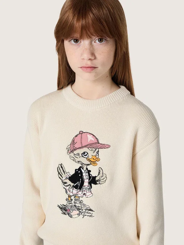 Goldfarbener Mädchenpullover aus weissem Baumwollgarn mit Maskottchen-Stickerei