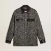 Graue Jacke im Fischgrätenmuster mit schwarzen Lederdetails