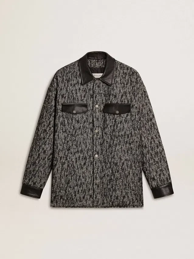 Graue Jacke im Fischgrätenmuster mit schwarzen Lederdetails