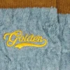 Hellblaue gerippte Socken mit braunen Details und gelbem Logo