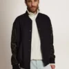 Herren-Bomberjacke aus dunkelblauer Wolle mit Lederärmeln