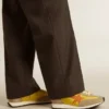 Herren-Marathon mit gelbem Nylon-Obermaterial und orangefarbenem Stern