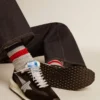 Herren-Marathon mit schwarzem Ripstop-Nylon-Obermaterial und silbernem Stern