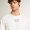 Herren-T-Shirt aus Baumwolle in Worn-White-Optik mit schwarzer Beschriftung