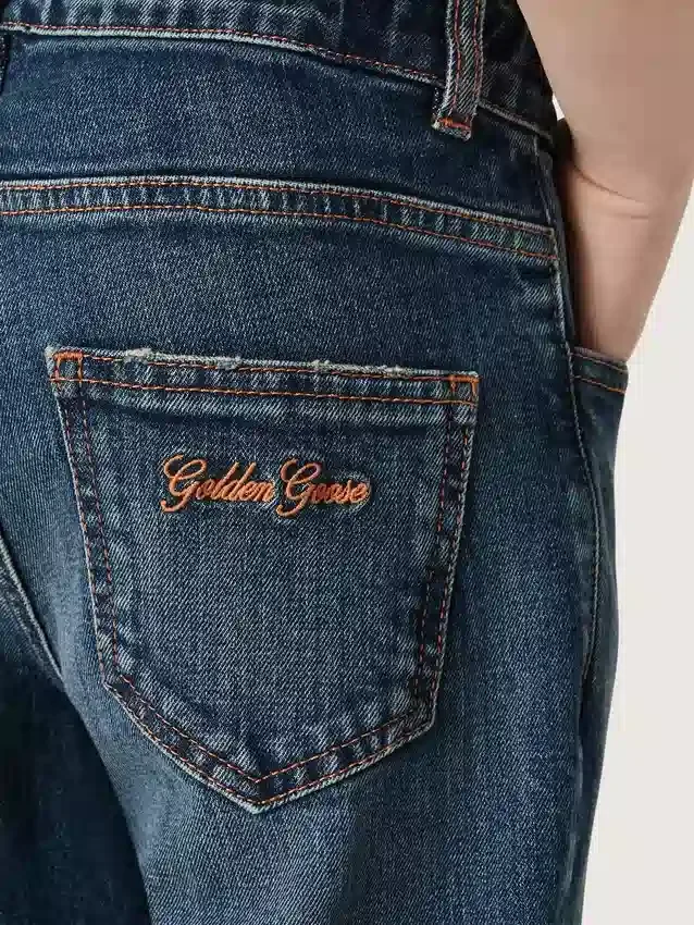 Jeans für Jungen mit unversäuberten Säumen und Stickerei