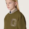 Journey Unisex-Bomberjacke aus militärgrünem Nylon-Twill mit gesticktem Aufnäher