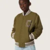 Journey Unisex-Bomberjacke aus militärgrünem Nylon-Twill mit gesticktem Aufnäher