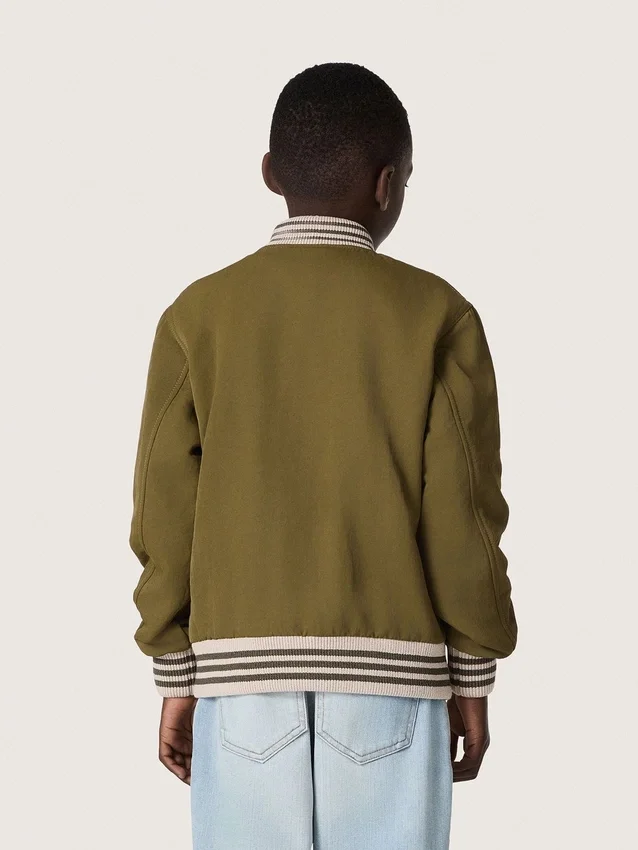 Journey Unisex-Bomberjacke aus militärgrünem Nylon-Twill mit gesticktem Aufnäher