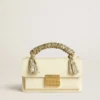 Kleine Venezia-Tasche aus butterfarbenem, geripptem Leder mit geflochtenem Band