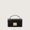 Kleine Venezia-Tasche aus schwarzem, geprägtem Leder mit goldenen Details
