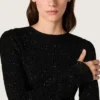 Langes Damenkleid aus schwarzem Mesh mit schwarzen Pailletten