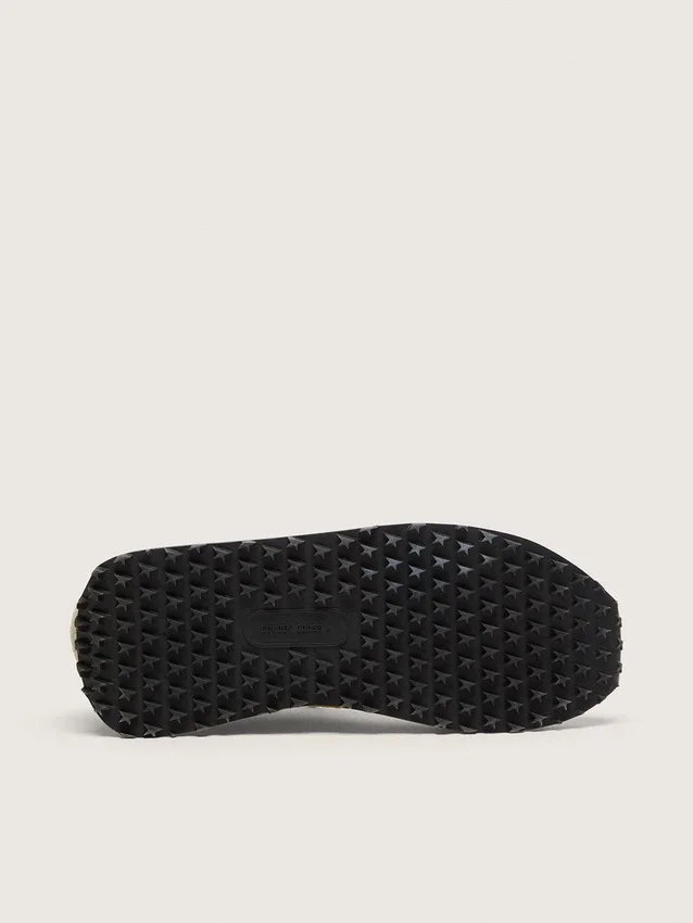 Herren-Marathon mit gelbem Nylon-Obermaterial und orangefarbenem Stern