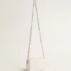 Mini Star Bag aus butterweissem Leder mit Ton-in-Ton-Stern