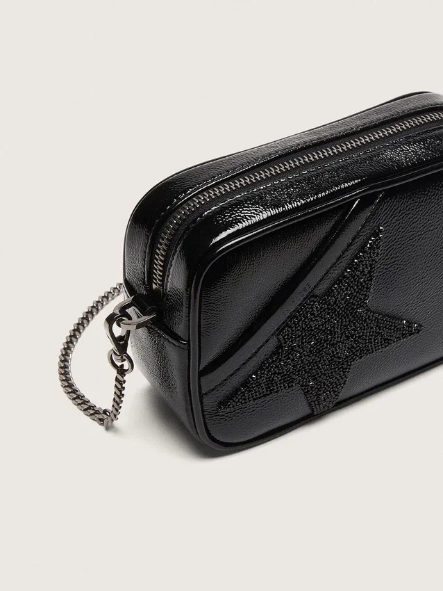 Mini Star Bag aus schwarzem Leder mit Swarovski-Kristallstern