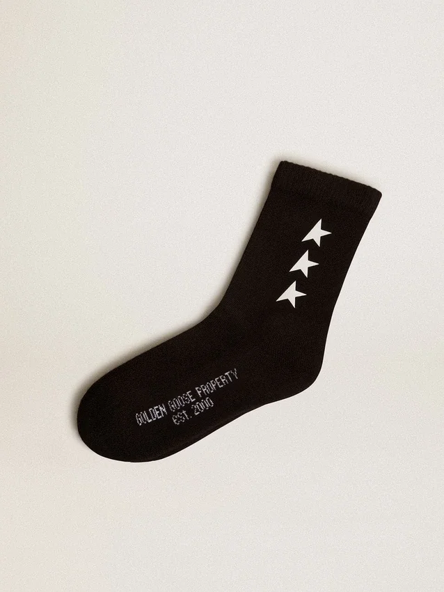 Schwarze Socken mit kontrastierenden weissen Sternen