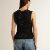 Schwarzes Mesh-Strickoberteil mit Pailletten und kontrastierenden Details