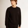 Schwarzes Sweatshirt aus der Archibald Star Collection mit Ton-in-Ton-Stern auf der Vorderseite