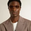 Sonnenbrille im Aviator-Stil mit goldenem Rahmen und beigen Gläsern