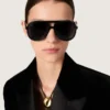 Sonnenbrille im Aviator-Stil mit schwarzem Rahmen und schwarzen Gläsern