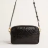 Star Bag aus glänzendem schwarzem Leder mit Ton-in-Ton-Stern