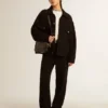 Star Bag aus glänzendem schwarzem Leder mit Ton-in-Ton-Stern