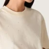 Unisex-Hemd «Star» aus weisser Baumwolle mit durchgehenden Kristallen im Farbverlauf und Aufdruck auf der Rückseite