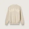 Unisex-Pullover mit Rundhalsausschnitt aus beiger Baumwolle mit Aufnäher auf der Vorderseite und Logo auf der Rückseite