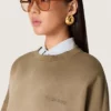 Unisex-Sweatshirt aus militärgrüner Baumwolle im Bleach-Look mit gesticktem Logo